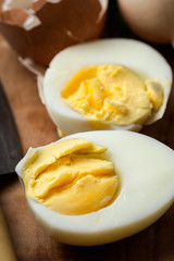 Baked eggs on wooden background
