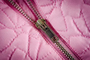 Zipper on pink balon jacket close-up shot