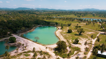 Fototapeta na wymiar Aerial drone view of beautiful lagoon ponds on tropical island during sunny summer day