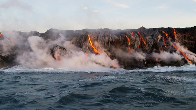 Red hot lava pouring into the Pacific ocean from erupting Kilauea volcano Big Island Hawaii USA 