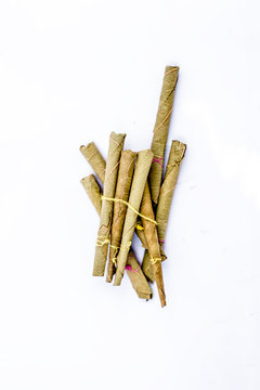 Close up of bidi or thin cigar or small cigarette isolated on white.