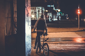 woman with bicycle in city