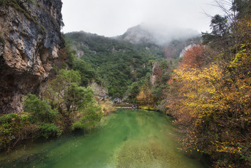 Naklejka na ściany i meble Autumn landscape, river in Somiedo natural park, Asturias, Spain.