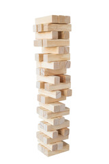 An unstable and incomplete tower of wooden blocks isolated on white background.