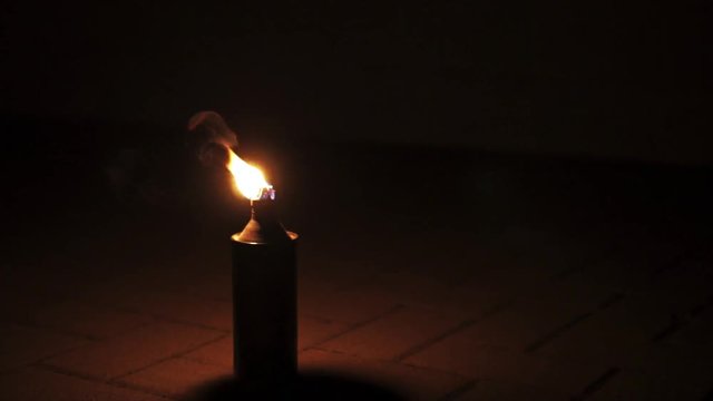 Fire lighting wick/can in slow motion