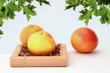 Fresh juicy grapefruits on a white table
