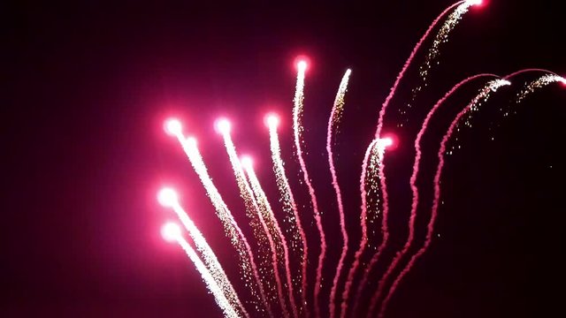 Half-round of bright colorful part of firework on black background.
