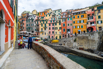 beach streets and colorful houses on the hill in Riomaggiore in Cinque Terre in Italy 