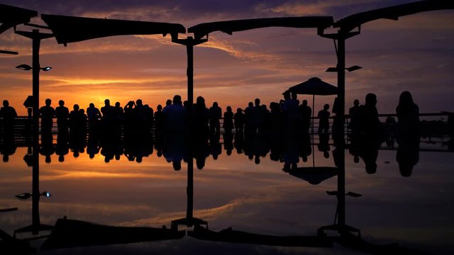 People viewing golden sunset Larcomar Shopping Mall Miraflores coastal district Pacific ocean Lima Peru South America 