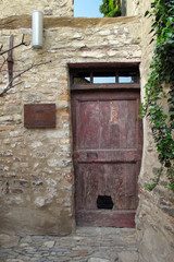 Old doorway in Monforte d'Alba, a town in the Piemonte wine region of northern Italy.