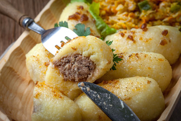 Potato dumplings stuffed with minced meat.