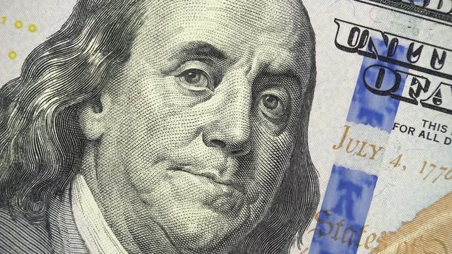 Benjamin Franklin on US 100 dollar bill 2013 rotating, money close up. 4K ultra hd video clip