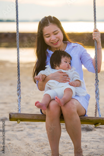Young Sweet And Happy Asian Chinese Woman Holding Baby Girl