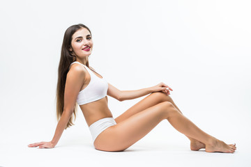 Fototapeta na wymiar Young beautiful woman in cotton underwear sitting on white background. Heathcare concept.