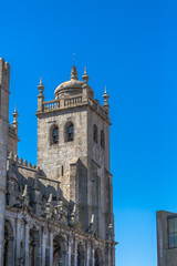 Fototapeta na wymiar View at the Porto Cathedral , Sé do Porto, tower and facade