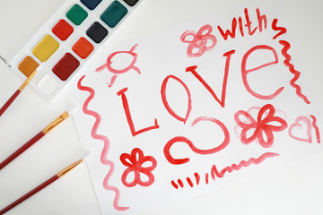 Drawing paints on a white sheet of paper