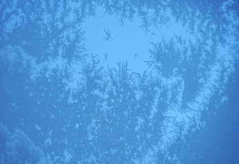 frost crystal on window glass in winter season