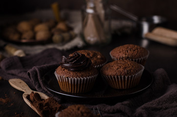 Homemade chocolate muffins with chocolate topping