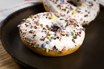 Wite donut, sweet American donuts sprinkled with sweet sugar blush