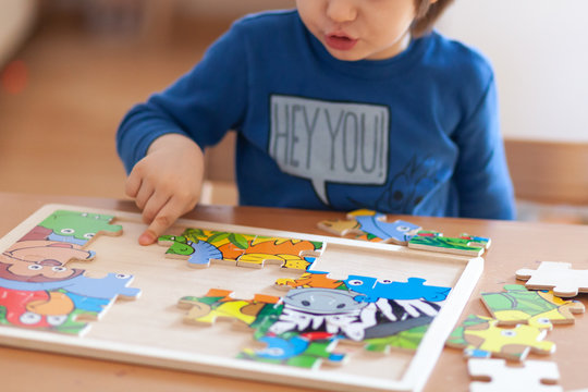 Child playing with puzzles