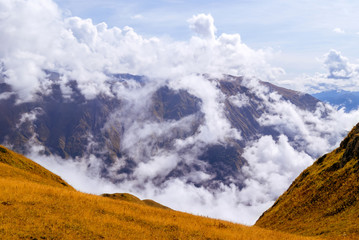 mountain landscape, top view of the valley with cumulus clouds