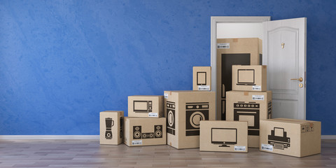Household kitchen appliances and home electronics in cardboard boxes and open door. E-commerce, internet online shopping and delivery concept.