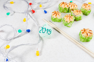 Obraz na płótnie Canvas Sushi New Year 2019. Holiday Sushi Photography.