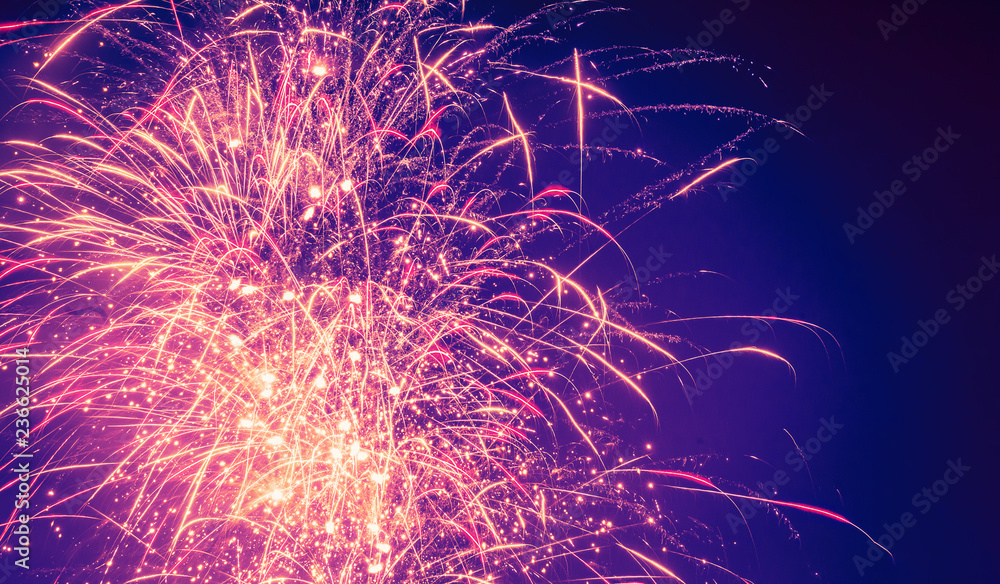 Poster brightly colorful fireworks on twilight background with copoy space