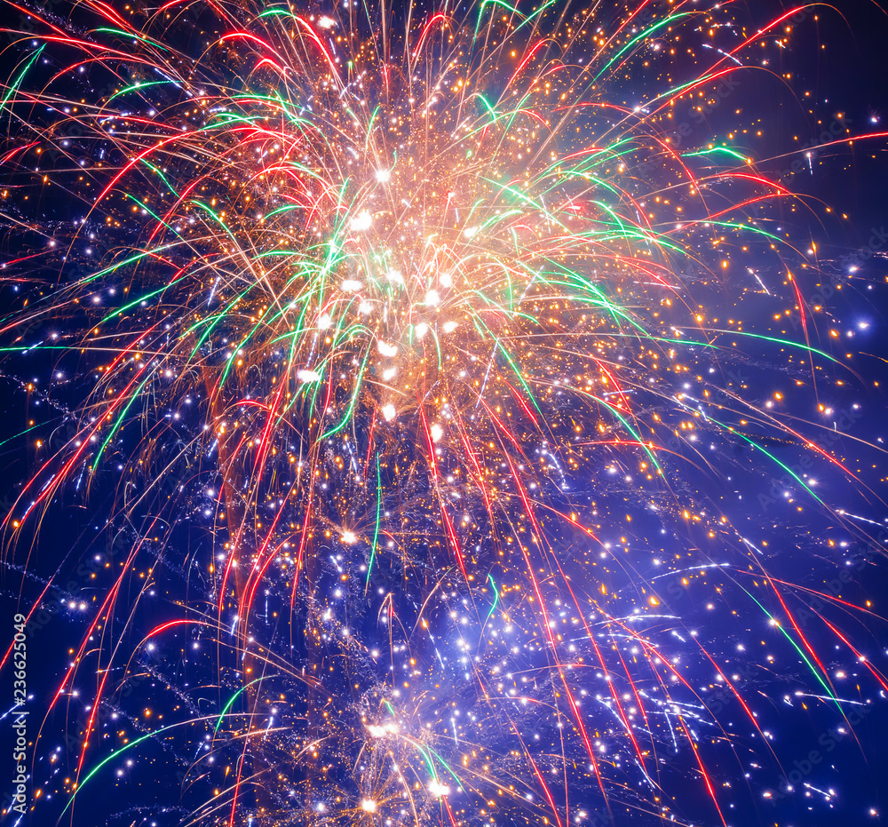 Poster brightly colorful fireworks on twilight background with copoy space