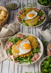 Potato pancakes with eggs and ham
