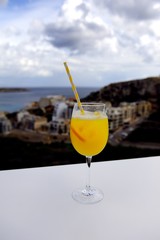 Admiring the view with a cocktail