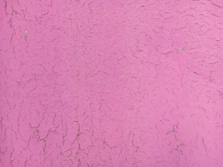 Old wall background with fissures of pink pastel