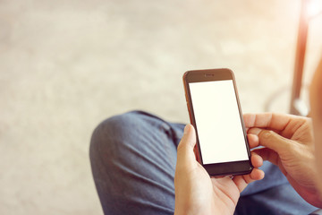 Close up of young man hand using mobile smartphone with blurred background, Mockup concept.
