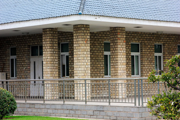 Metal railings and houses in a garden