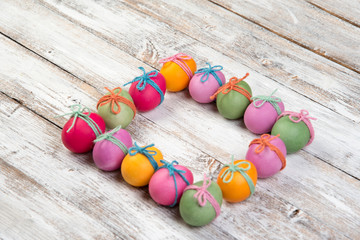 Easter eggs, frame, white wooden background, top view, copyspace