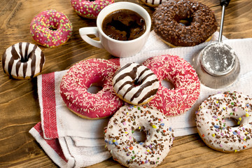 Obraz na płótnie Canvas Sweet pleasure for your taste - American donut and cup of coffe