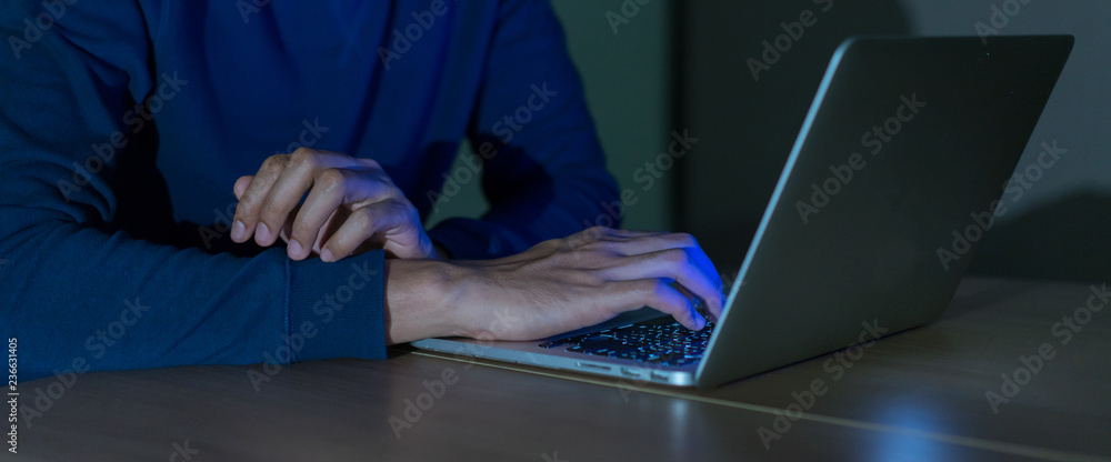 Wall mural close up on man hand typing or working on laptop for programming about cyber security , advance futu