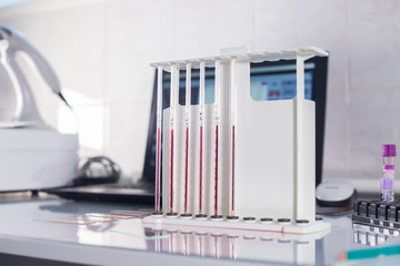 Medical clinic. A stand with pipettes filled with blood