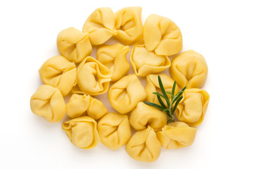 Raw homemade pasta,tortellini with herbs.