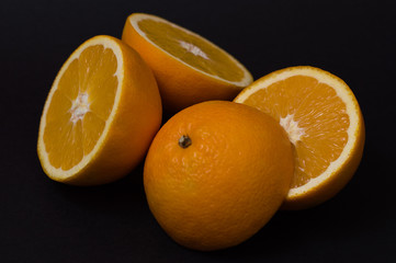 oranges on a black background
