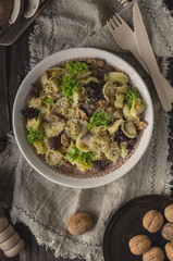 Homemade tortellini with mushrooms and walnuts