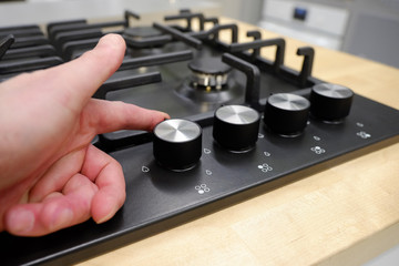 Knob control the position of modes for cooking in the oven. Close-up view from above.