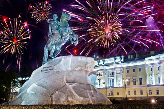 Russia. Petersburg. Monument to tsar Peter 1, "Bronze Horseman". inscription the Russian letters on a stone - to Peter I Ekaterina the Second and Christmas fireworks