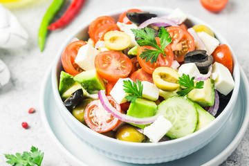 Avocado feta Greek salad in a bowl. Selective focus,close up, space for text.