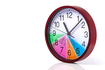 Time management concept: Round clock with a colored dial and action plan for a day on a white...