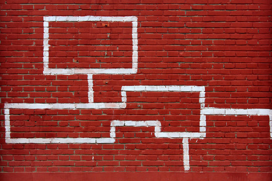 Graphic Symbol In Dark Red House On The Wall