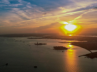 sunset top view with statue of Liberty