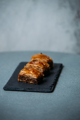 Baklava is a popular confection of puff pastry with nuts in syrup, widespread in cuisines of eastern nations.