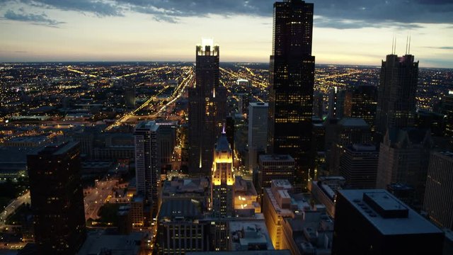Aerial sunset view of busy metropolitan Chicago city street traffic