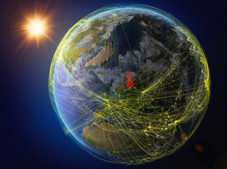 Finland from space. Planet Earth with network representing international communication, technology and travel.